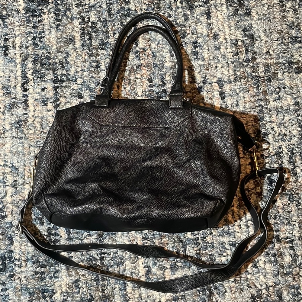 Black handbag soft leather with gold details and strap